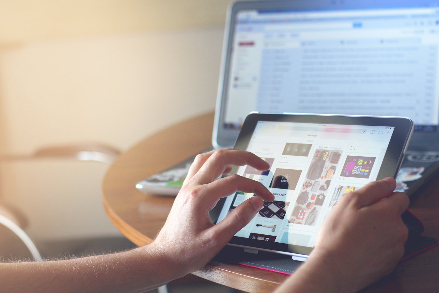 Person browsing an e-commerce site on a tablet.